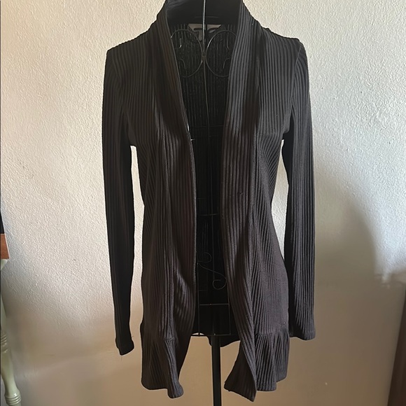Black Ribbed Open Front Cardigan with Ruffle Bottom. - Picture 1 of 9